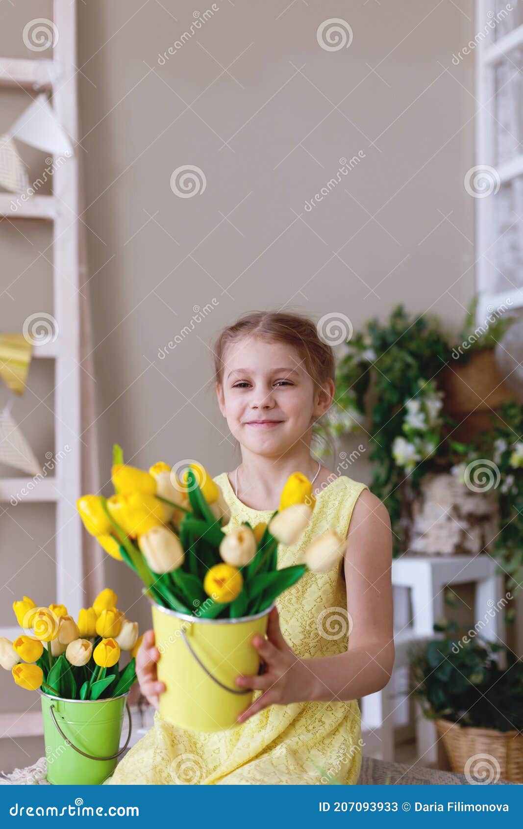 Portrait Of Teen Girl In Yellow Dress With Bouquet Of Tulips Stock