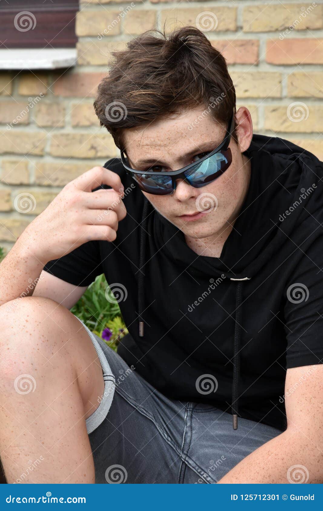 teenage boy with modern sunglasses