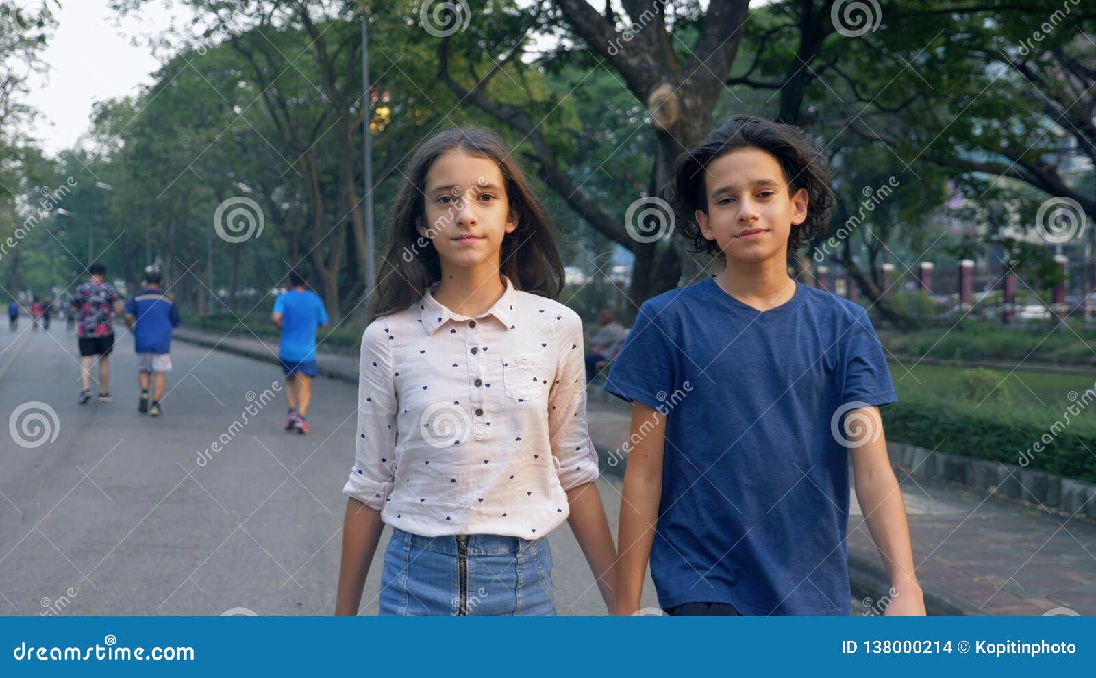 Portrait Of Teenagers Boy And Girl Walking In Nature In A Big Park With Pleasure Brother And Sister Twins Are Walking Stock Photo Image Of People Runner