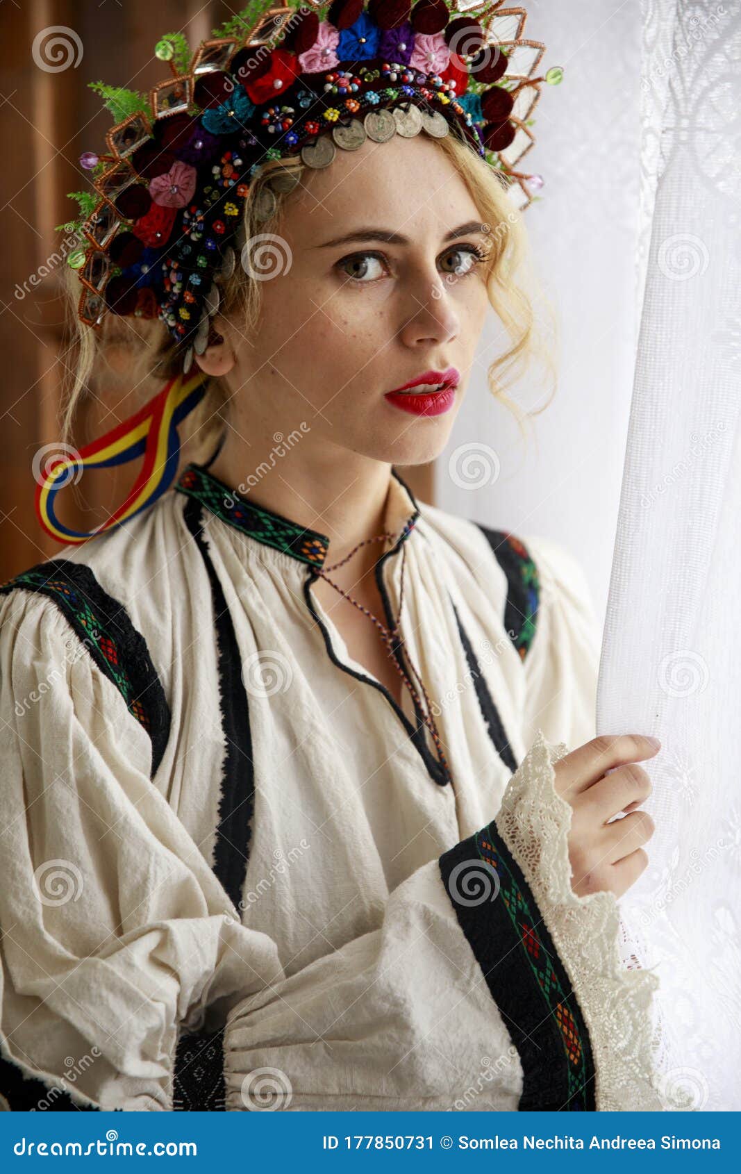 beautiful woman dressed in traditional romanian costume