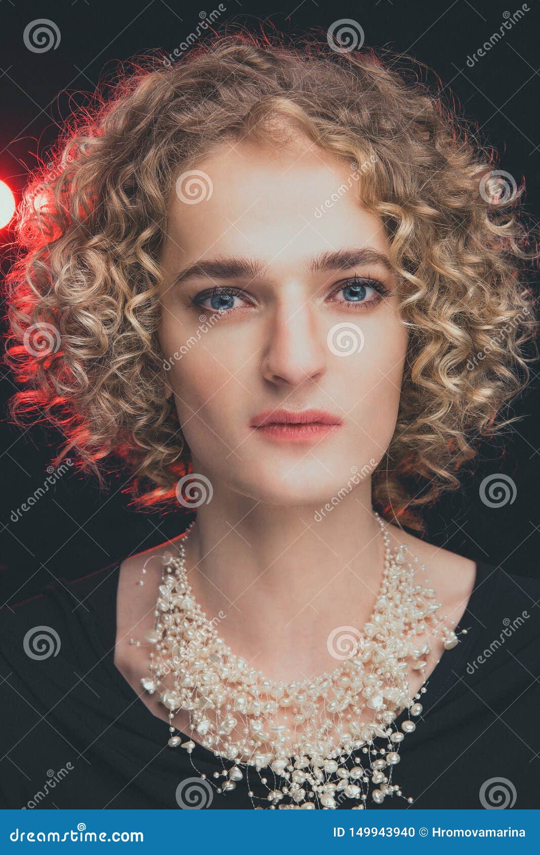 Portrait Of Transgender Guy Model With Blue Eyes And Blond