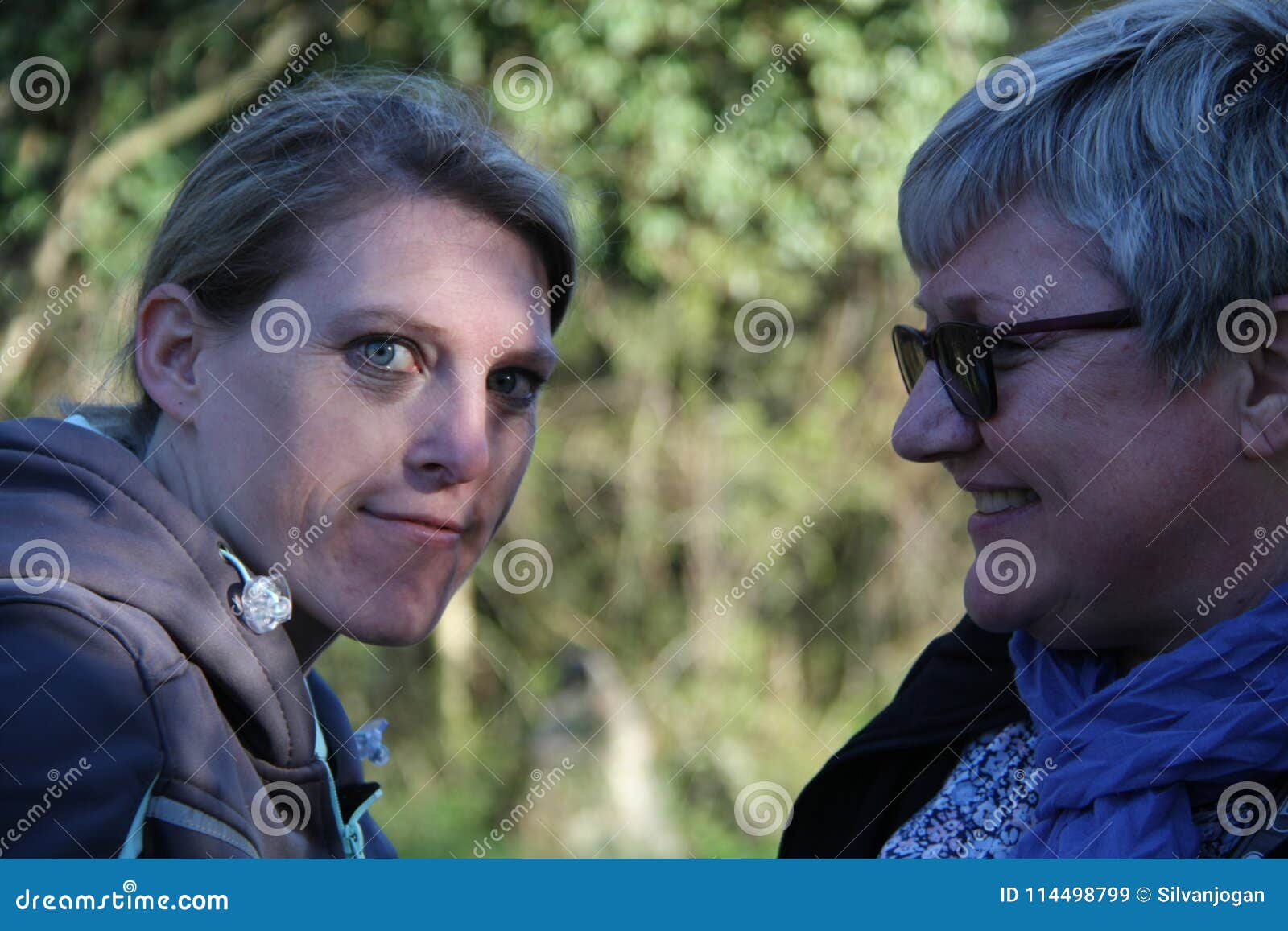 a portrait of two collegue ladies in the nature