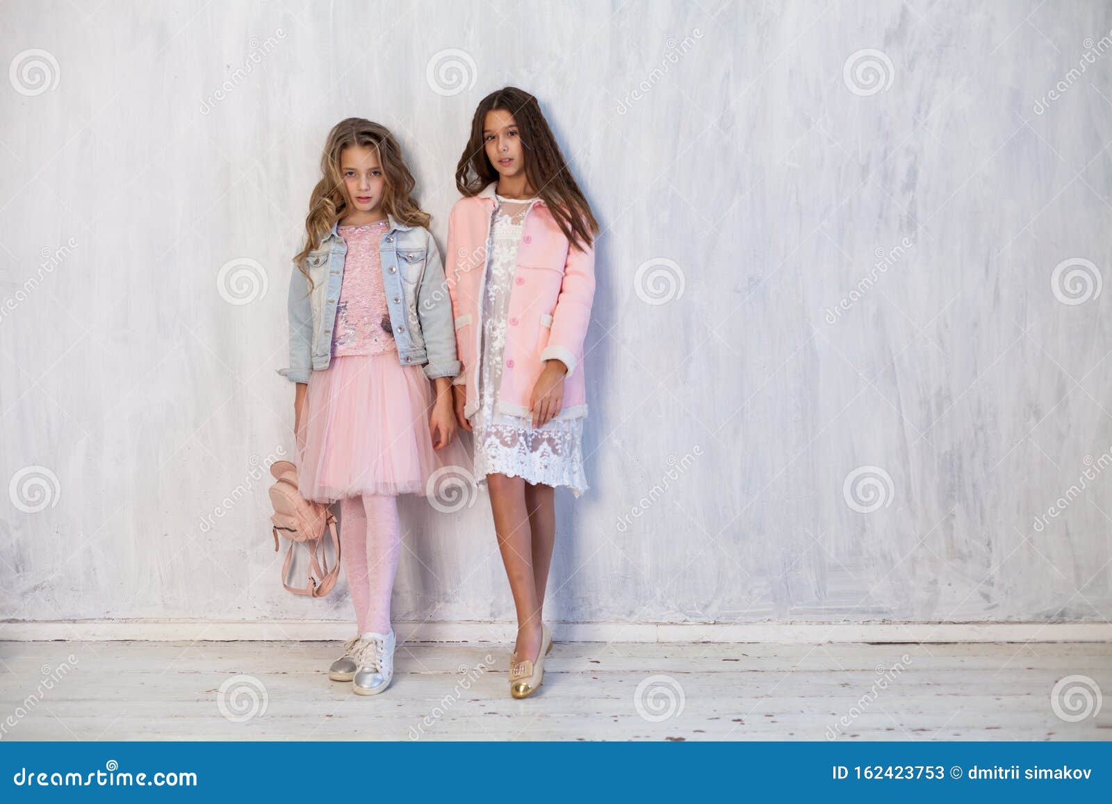 Portrait Of Two Fashionable Schoolgirl Girls Girlfriend In Pink Clothes Stock Image Image Of