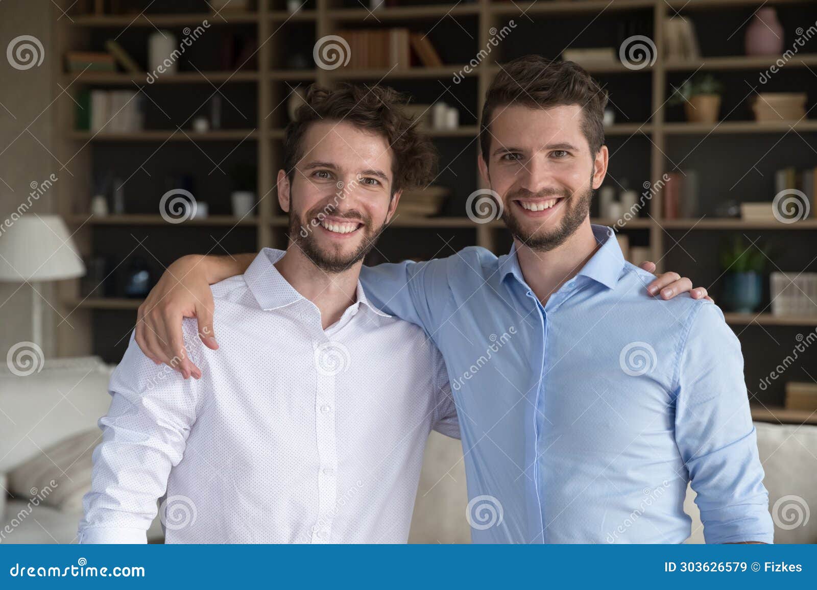 portrait of handsome brothers posing in studio Stock Photo - Alamy
