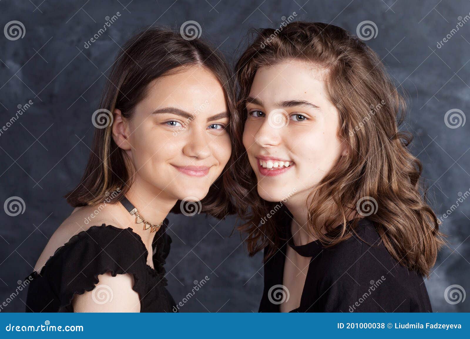 Portrait Of Two Natural Smiling Teenage Girls Close Up Lifestyle