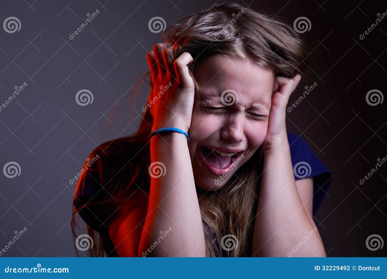 Portrait Of Unhappy Screaming Teen Girl Stock