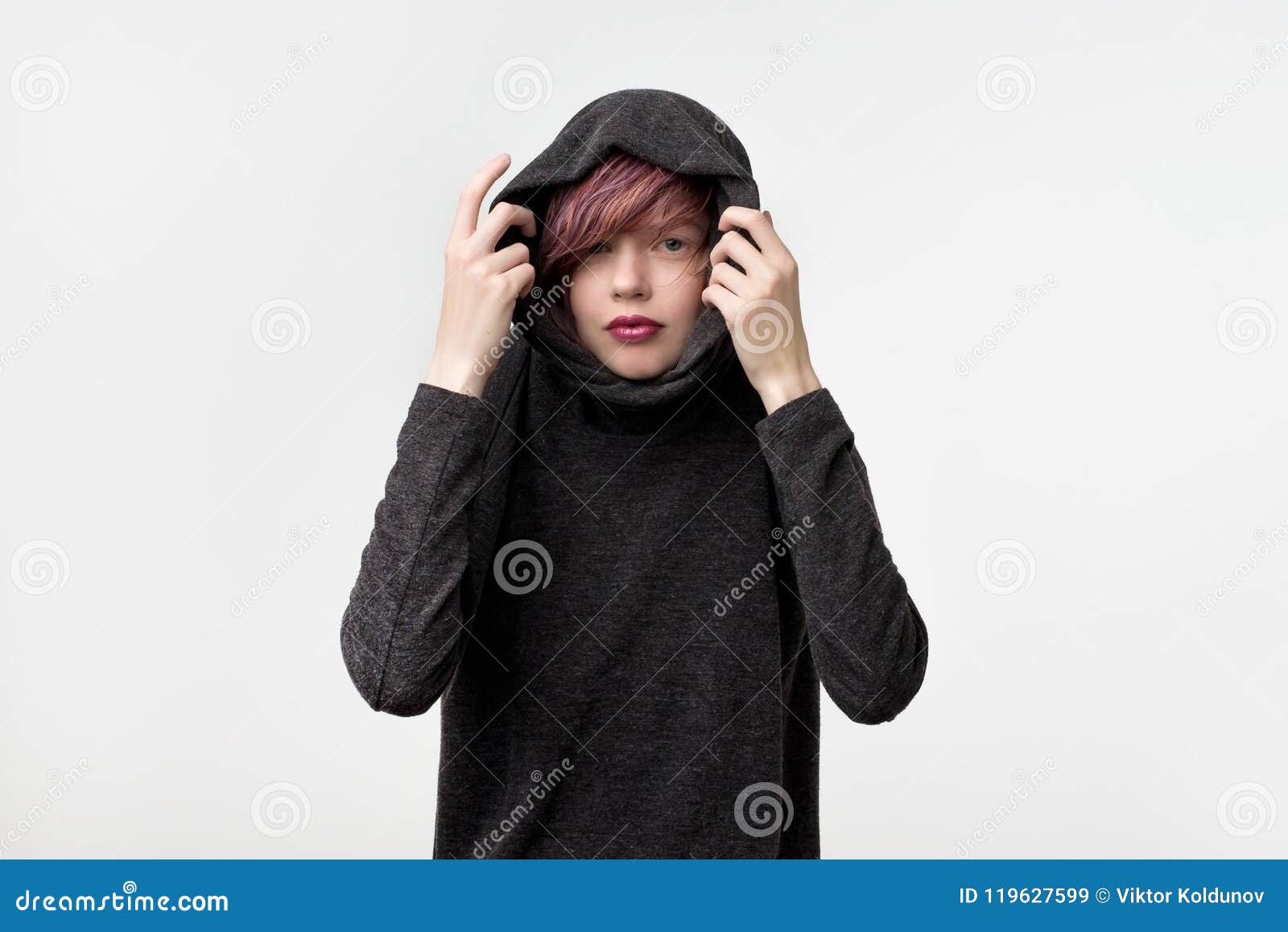 Portrait Of Unusual Informal Pretty Woman With Colorful Hairstyle She Is Pulling Up Hood And 