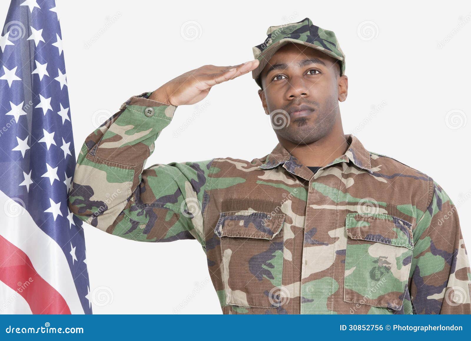soldiers saluting the flag