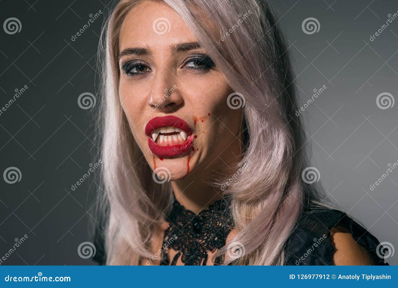 Vampire Woman with a Bloody Mouth and Teeth Fangs Celebrating a Stock ...