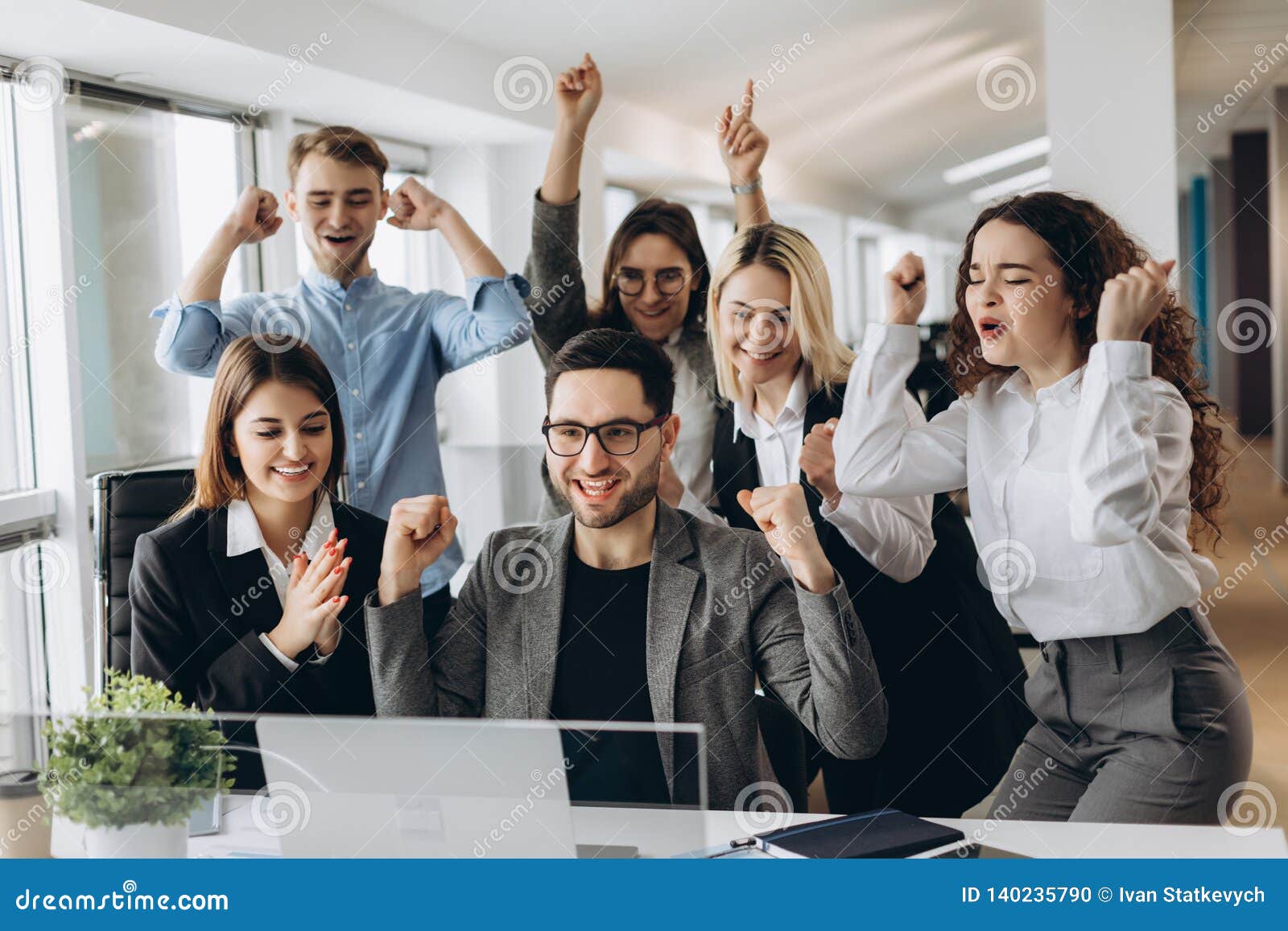 portrait of very happy successful expressive gesturing business team at office