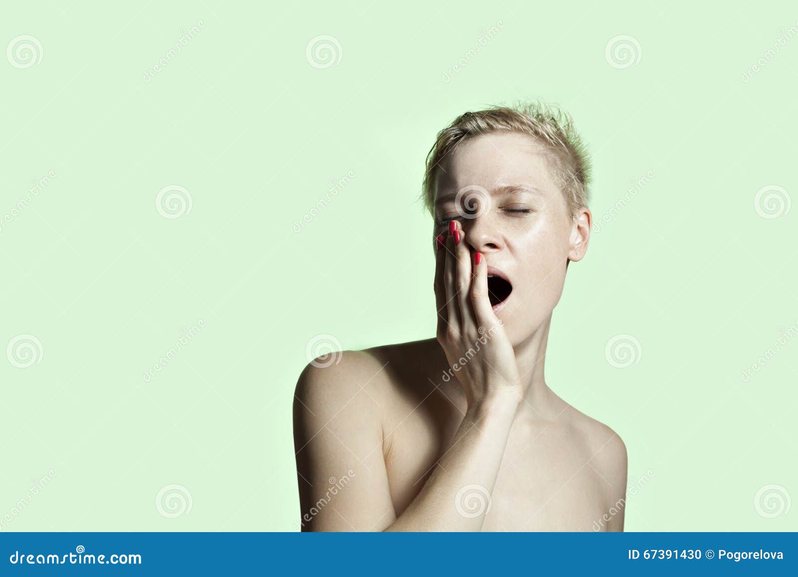 portrait of white young woman yawn, face with freckles, monochrome colore