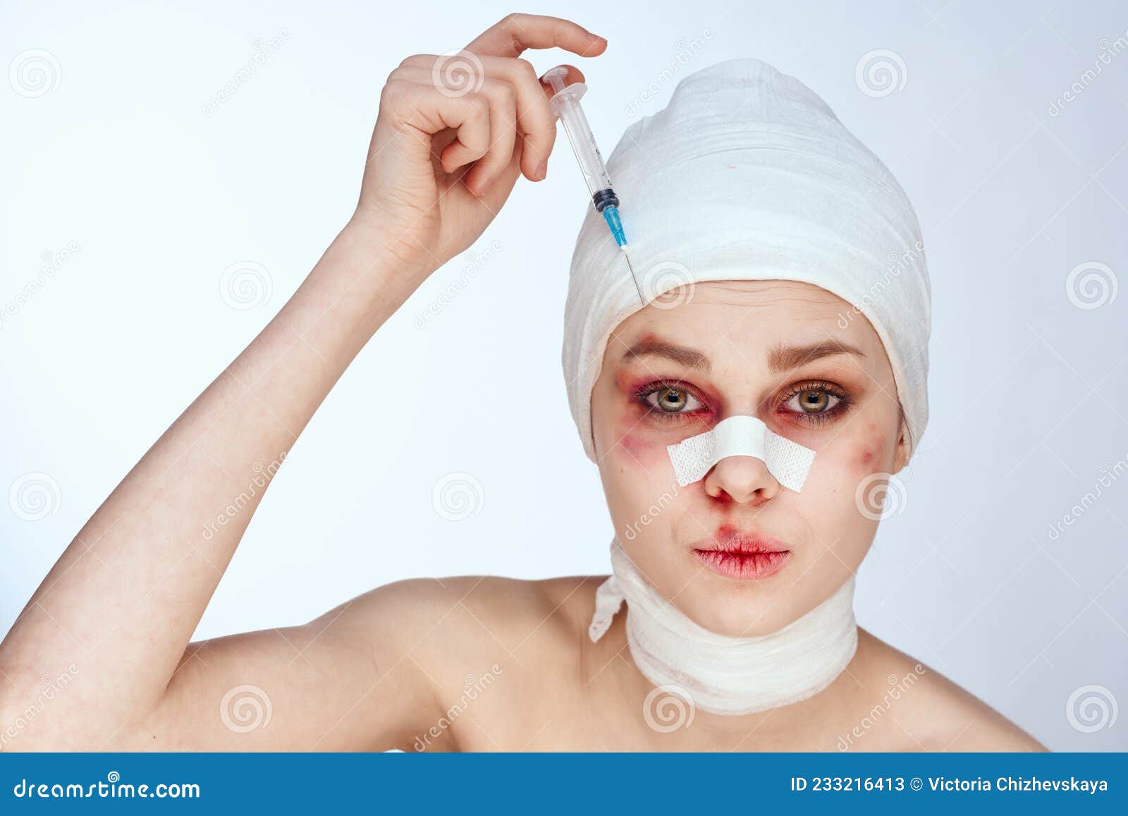 Portrait Of A Woman Bandaged Face The Syringe Sticks Out In The Head Isolated Background Stock