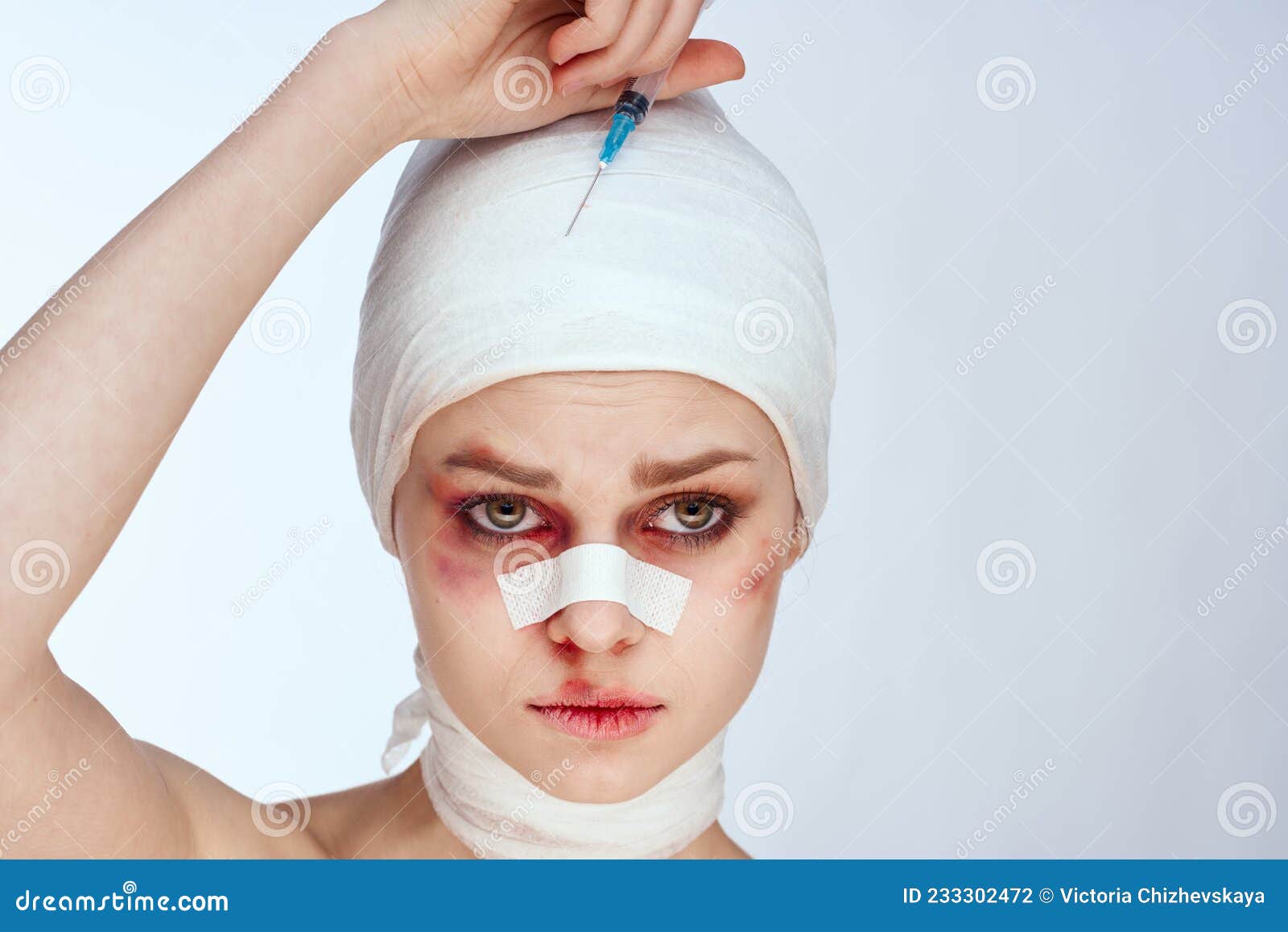 Portrait Of A Woman Bandaged Face The Syringe Sticks Out In The Head Isolated Background Stock