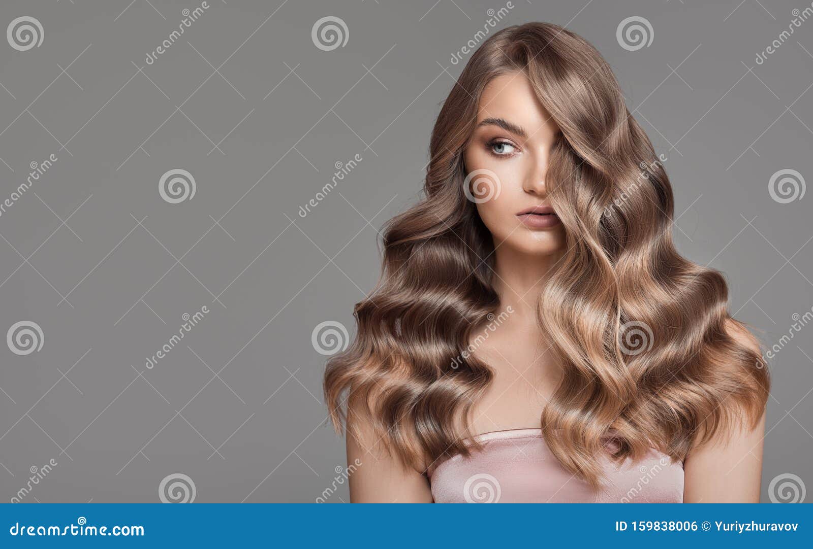 woman with beautiful natural long wavy blonde hair