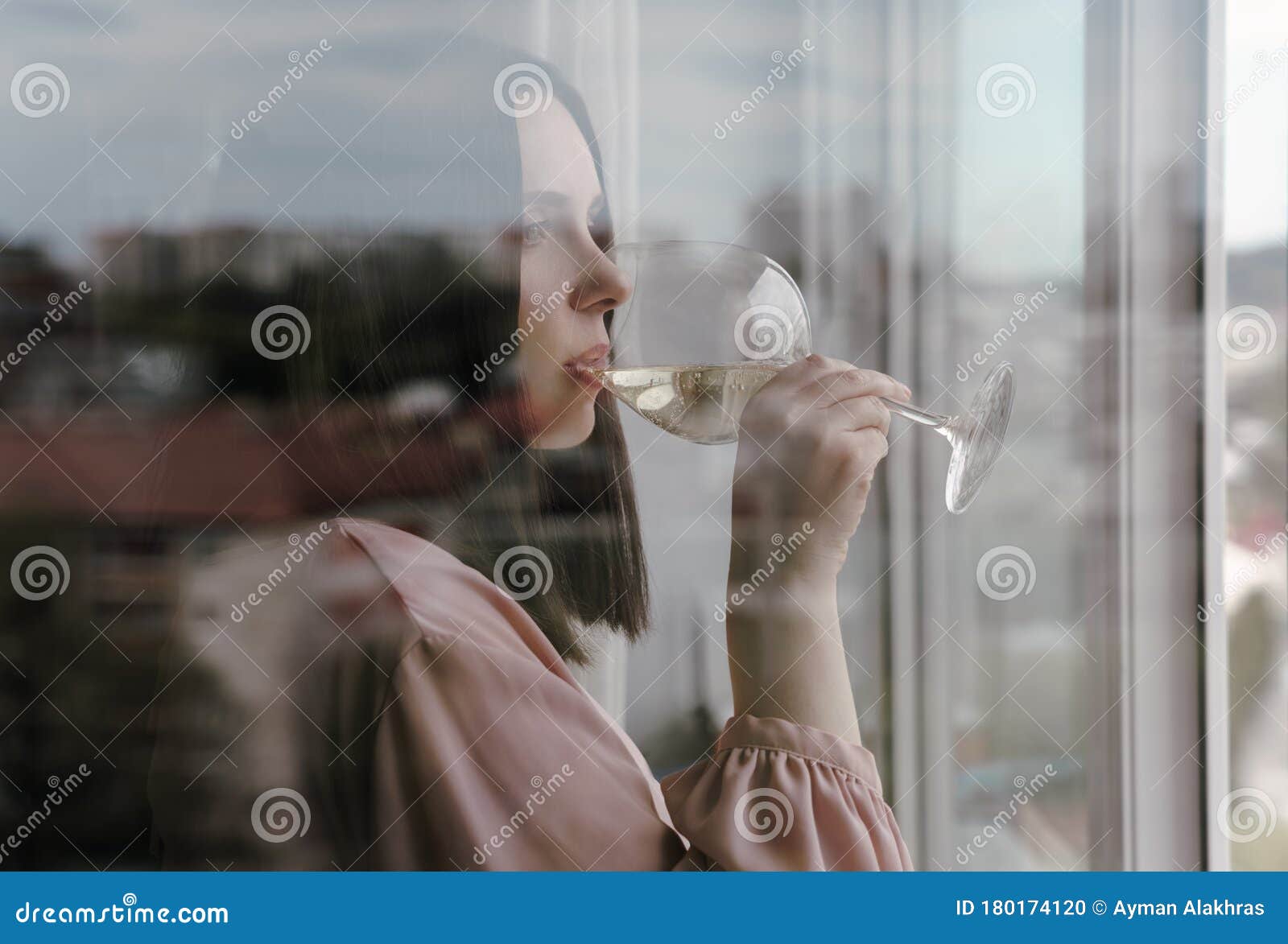 Portrait Of A Woman Behind The Window Drinking A Glass Of White Wine ...