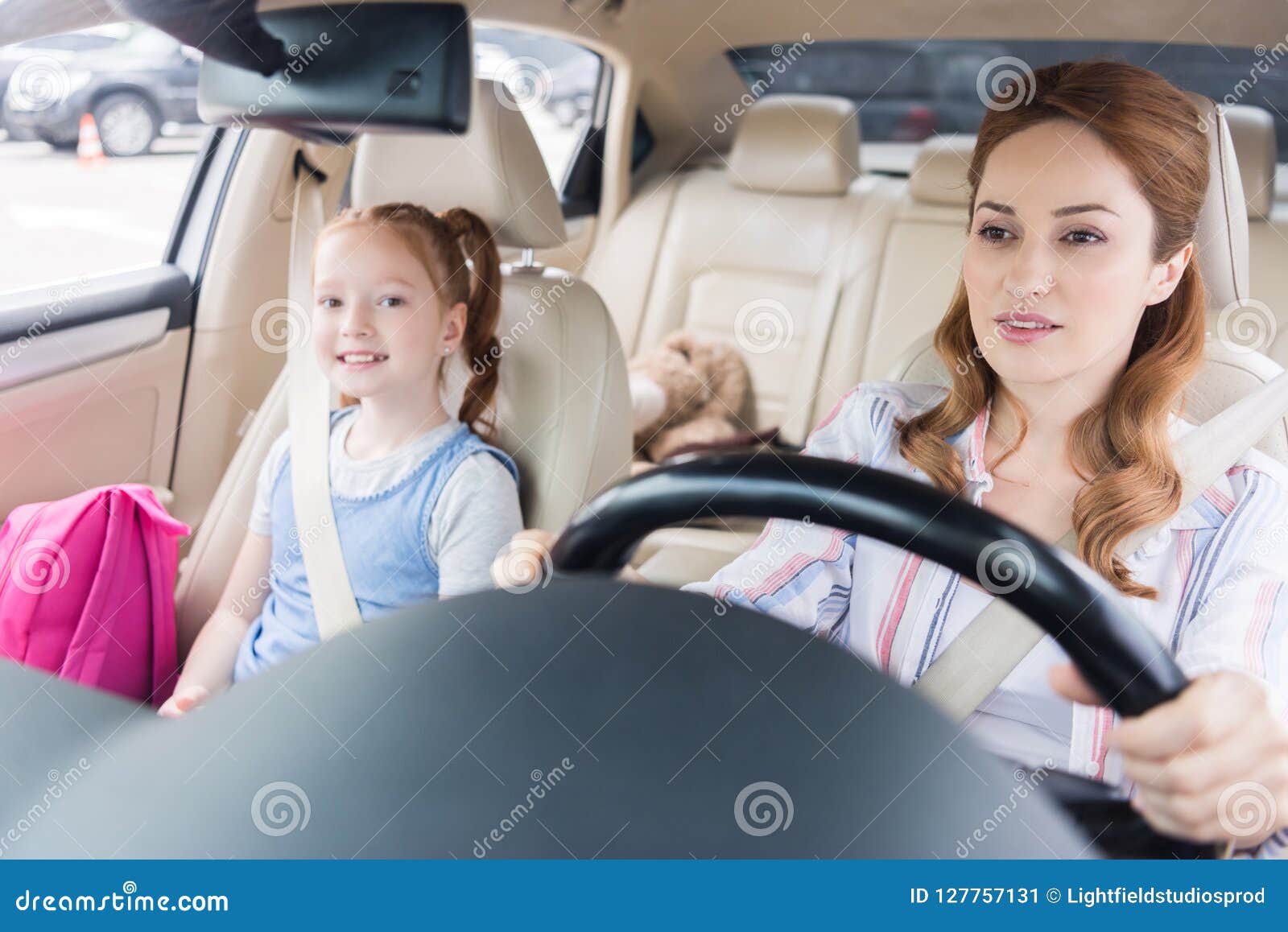 Portrait Of Woman Driving Car With Smiling Daughter Stock Image Image