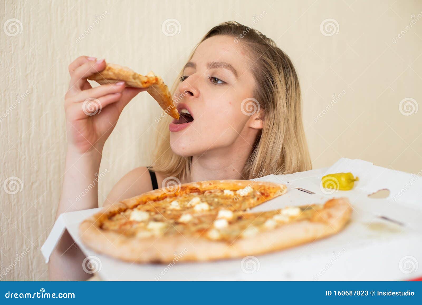 Portrait Of A Woman Eating Pizza Beautiful Young Woman In Black