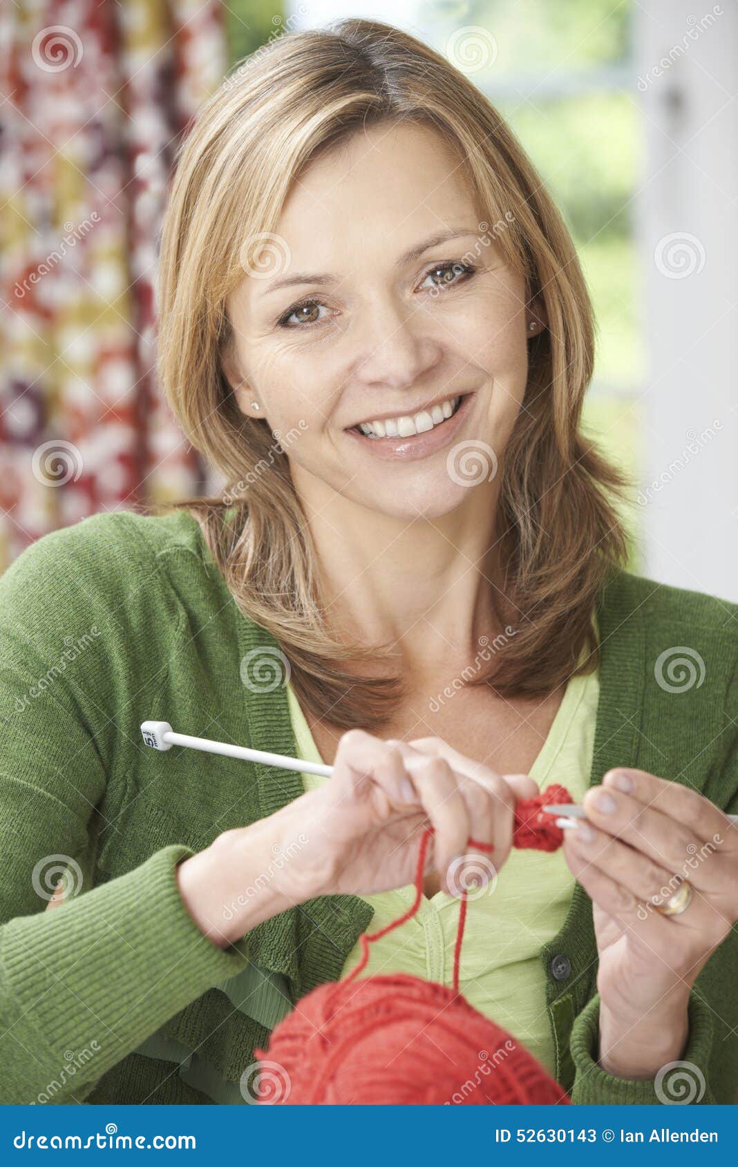 Crocheting and home hobby concept. Top view of crochet work with crochet  hook and pink yarn on white wooden table Stock Photo - Alamy