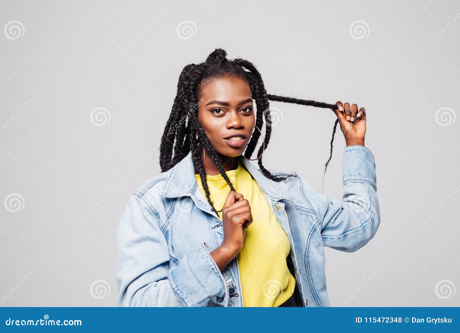 Portrait Of Woman With Hair Braided In Thin Plaits Or