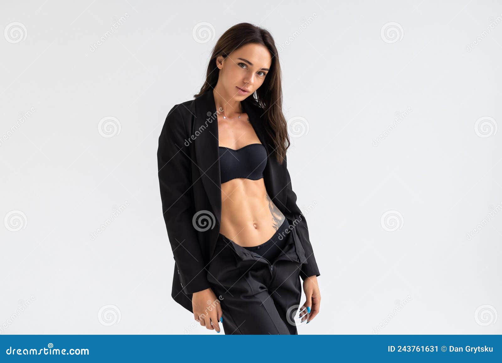 Portrait of a Woman Inside a Studio with a Grey Background Wearing a Black  Suit with Black High Heels and a Black Bra Stock Image - Image of young,  skin: 243761631