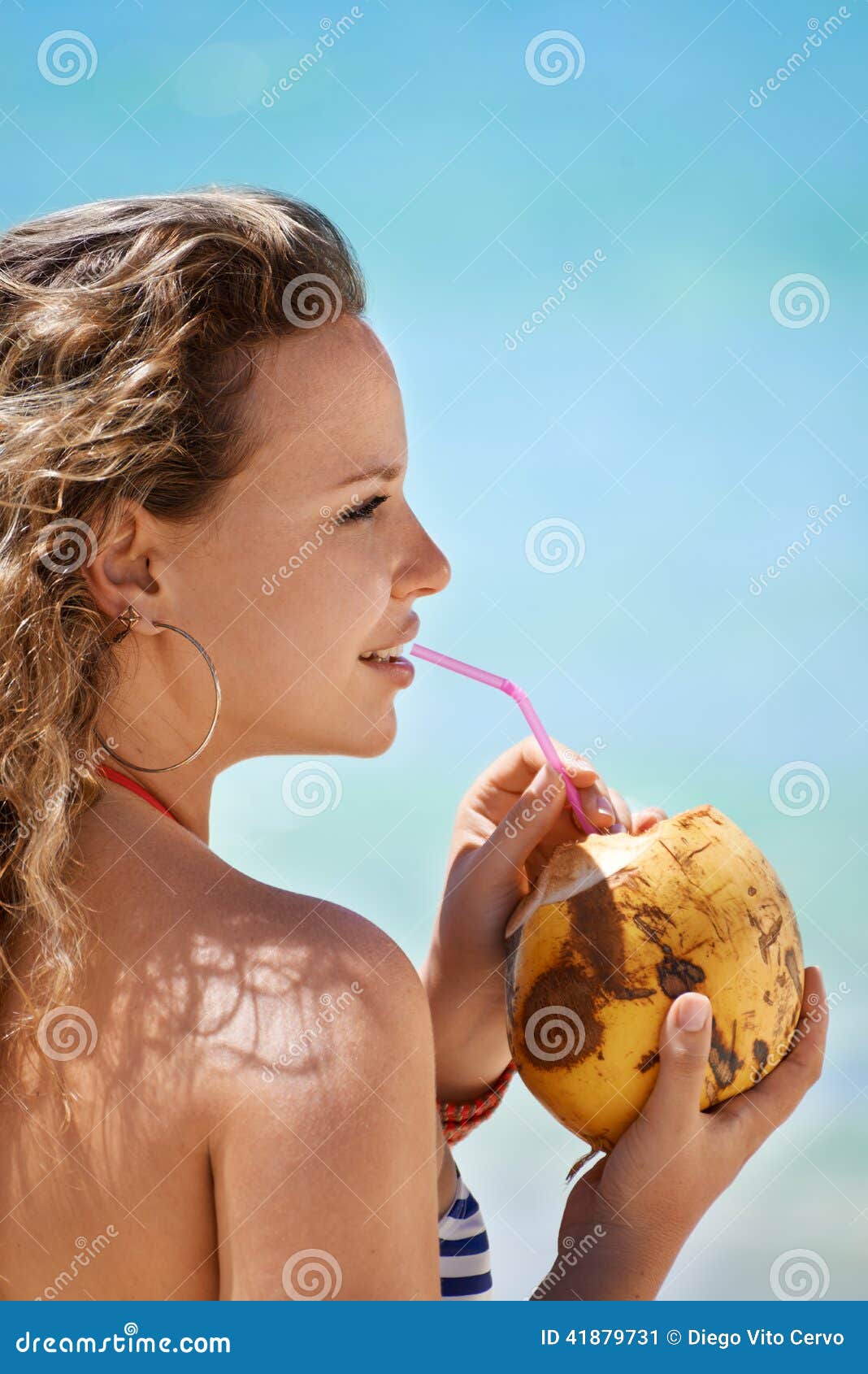 Portrait Of Woman Relaxing With Cocktail At Cuban Beach