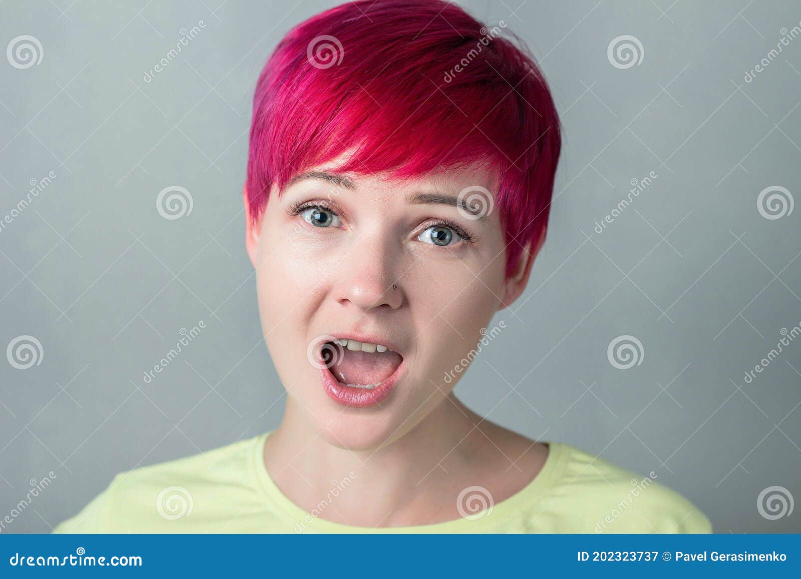 Portrait of a Woman with Short Dark Pink Hair and an Open Mouth Stock ...