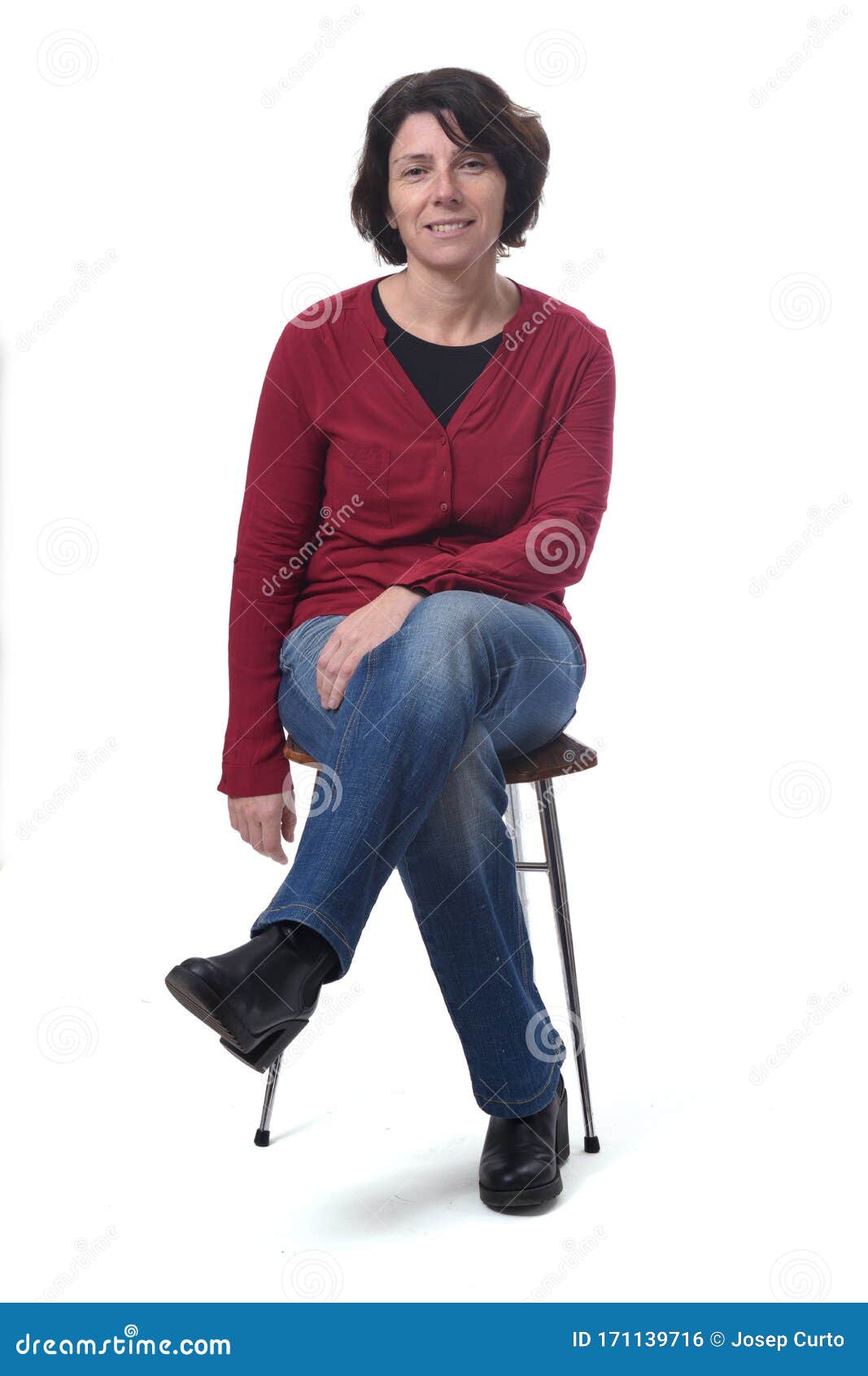Portrait Of A Woman Sitting On A Chair On White Background