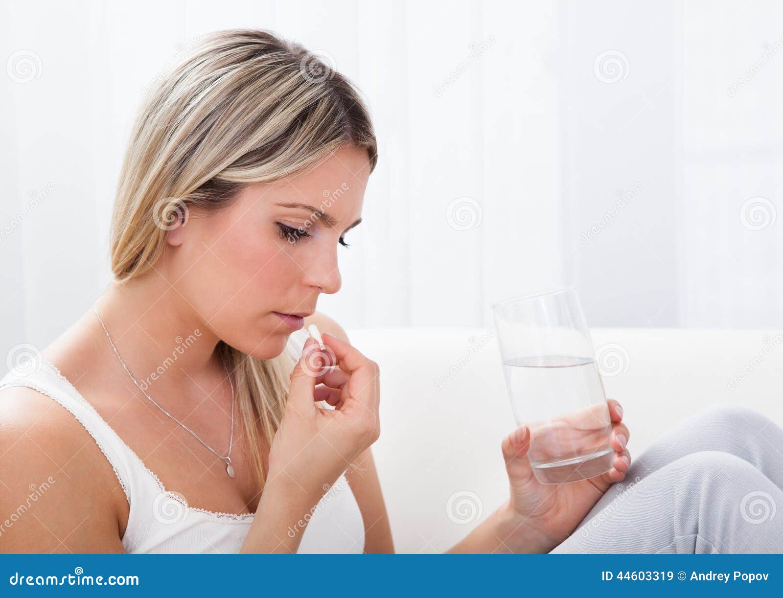 portrait of woman taking pills