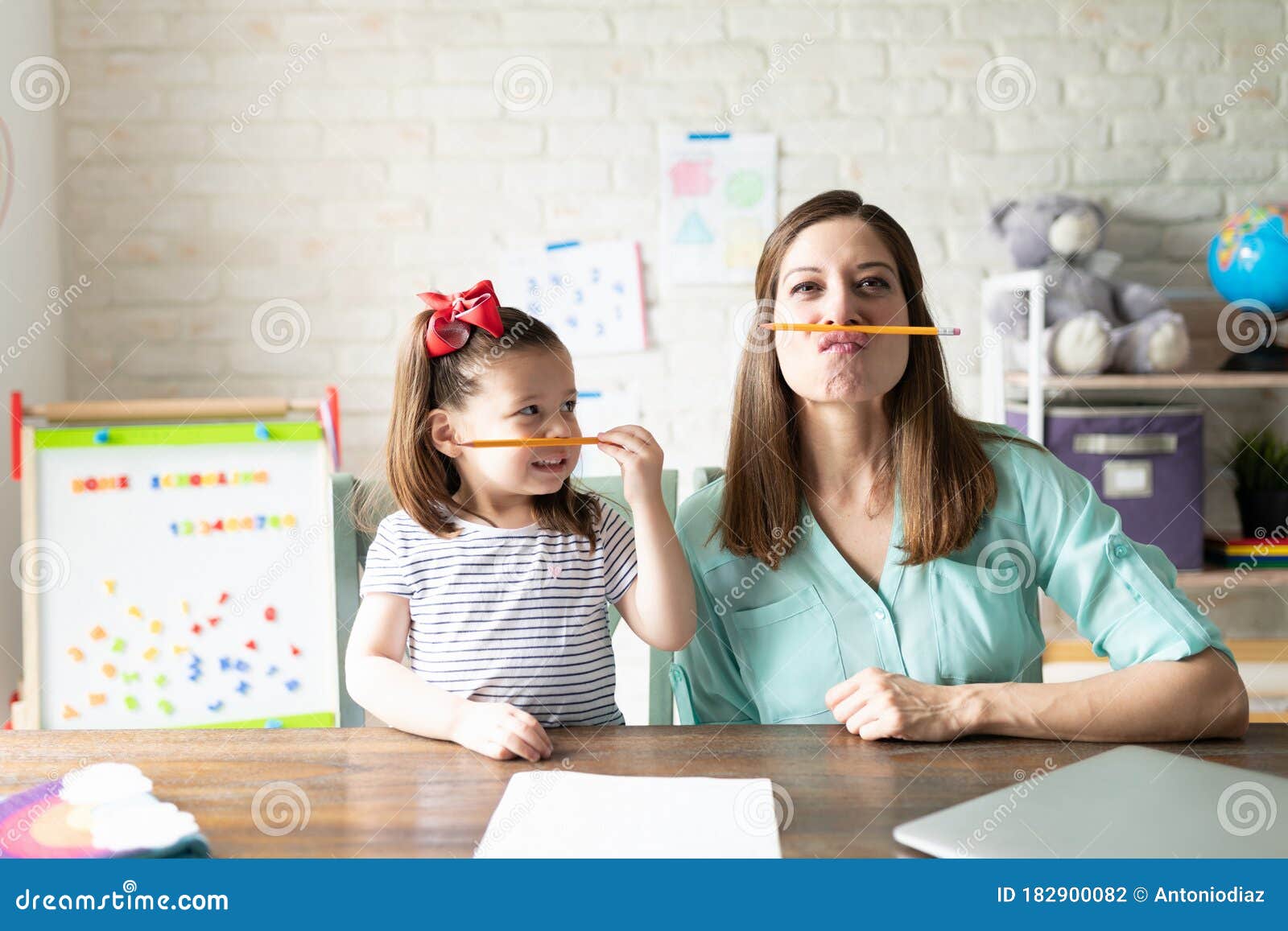 mother and daughter enjoying homeschooling together