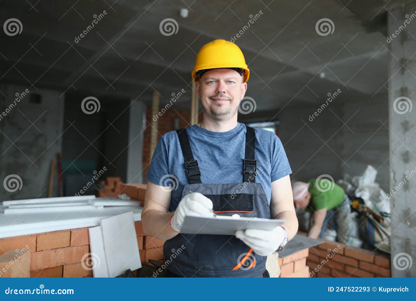 worker hold clipboard and write down consumable materials for renovation