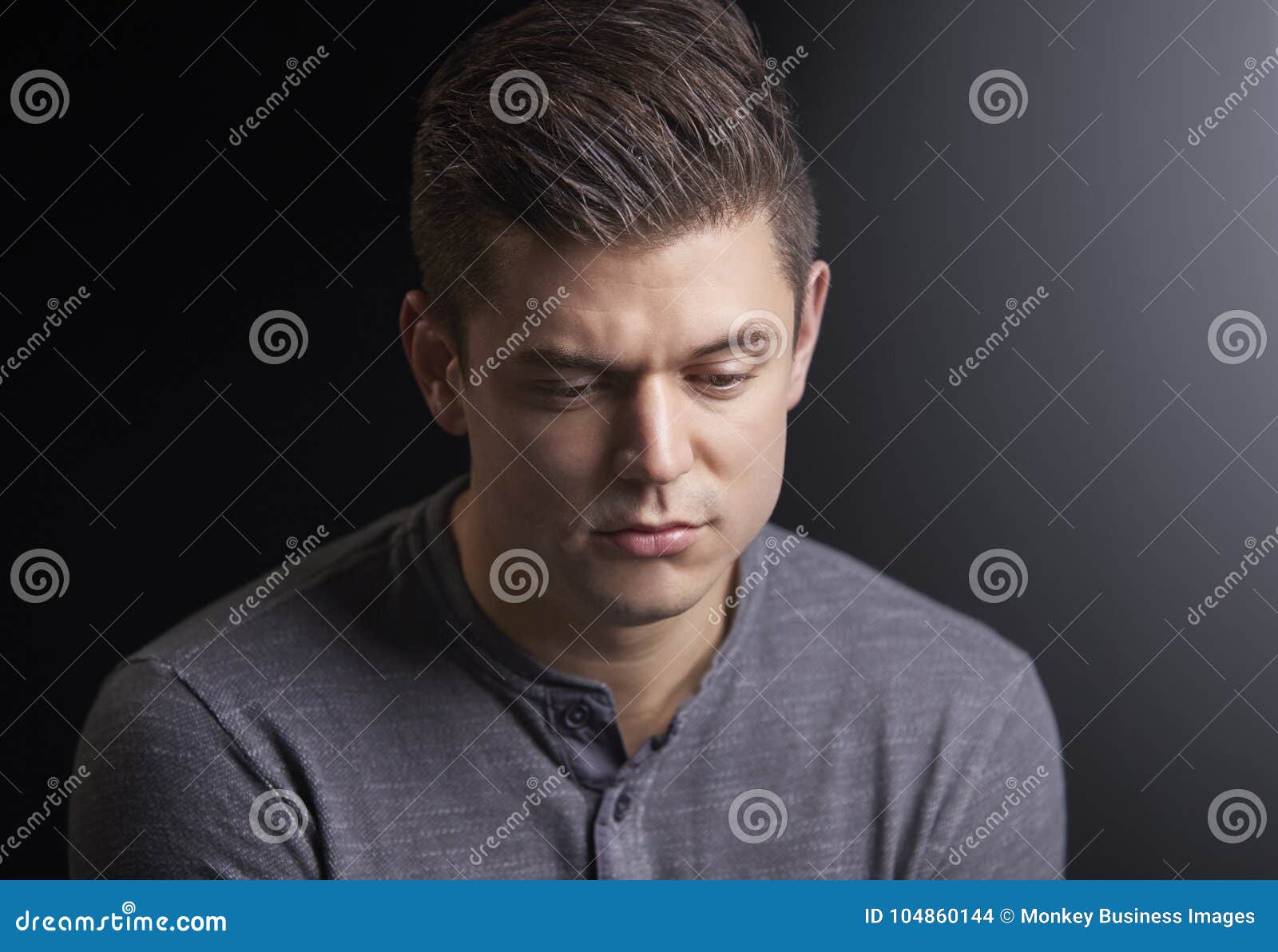 Portrait Of A Worried Young Man Looking Down Stock Photo - Image of ...