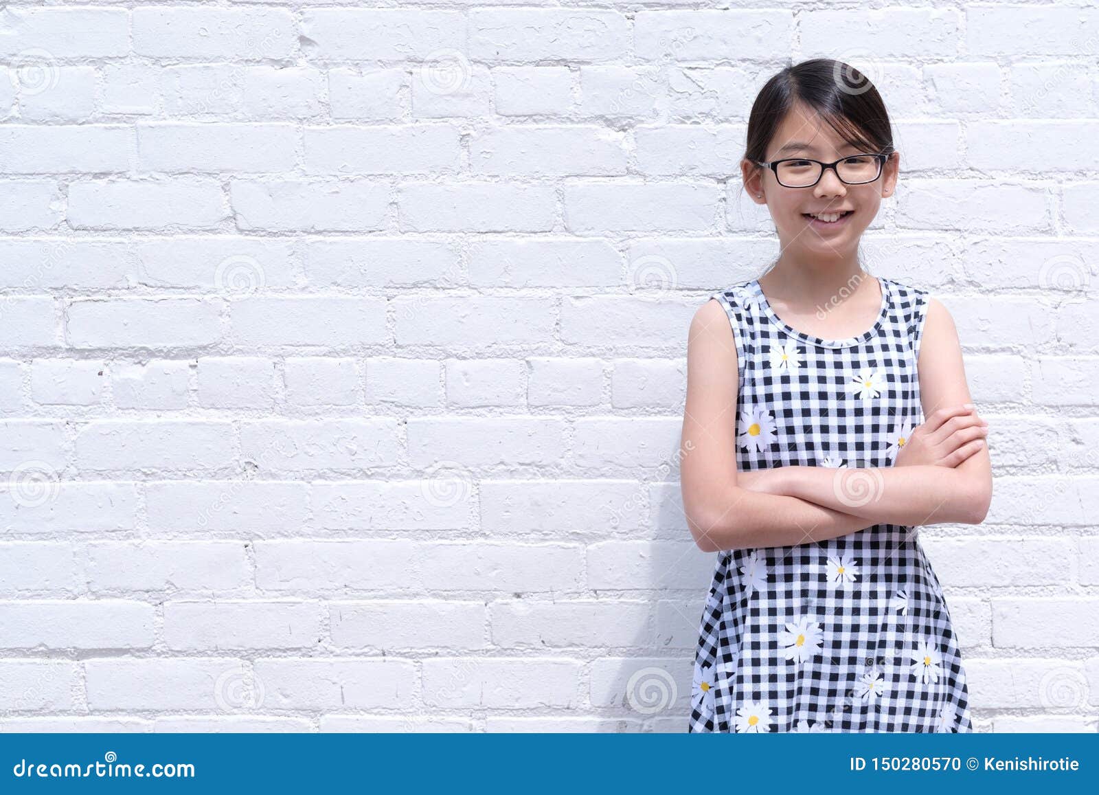 Portrait Of Young Asian Girl Against Red Brick Wall Stock 