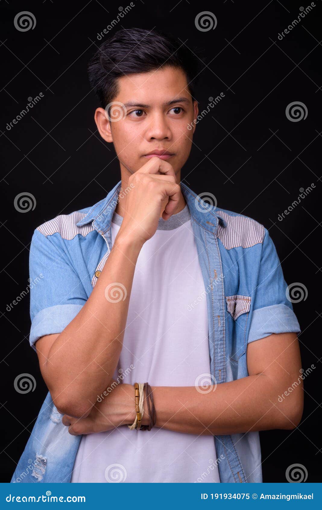 Portrait of Young Asian Man Against Black Background Stock Image ...