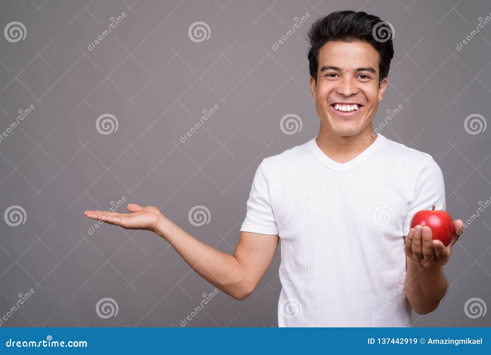 Portrait of Young Asian Man Against Gray Background Stock Image - Image ...