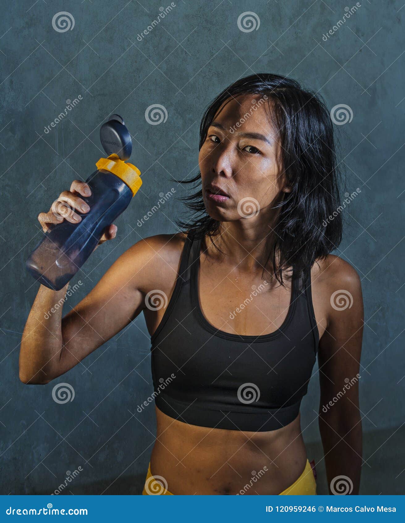 Portrait of Young Athletic and Fit Asian Korean Woman in Fitness Top  Holding Drinking Water Bottle Posing Cool in Bad Girl Defiant Stock Photo -  Image of advertising, combat: 120959246
