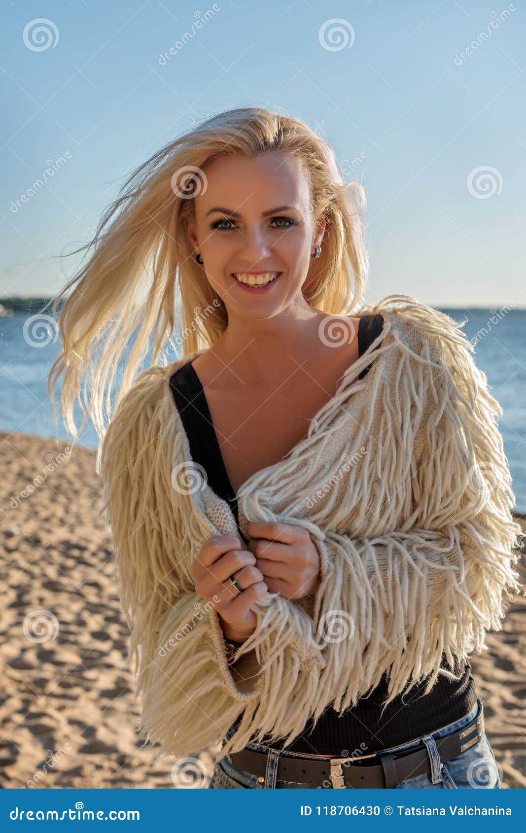 Portrait of a Young Attractive Blond Woman Smiling Broadly on the Coast ...