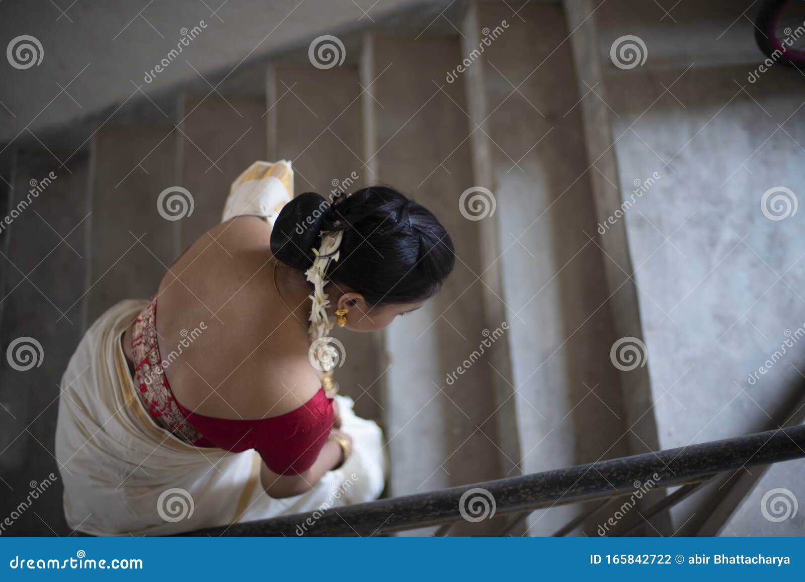 Portrait Of An Young And Attractive Indian Woman In White Traditional