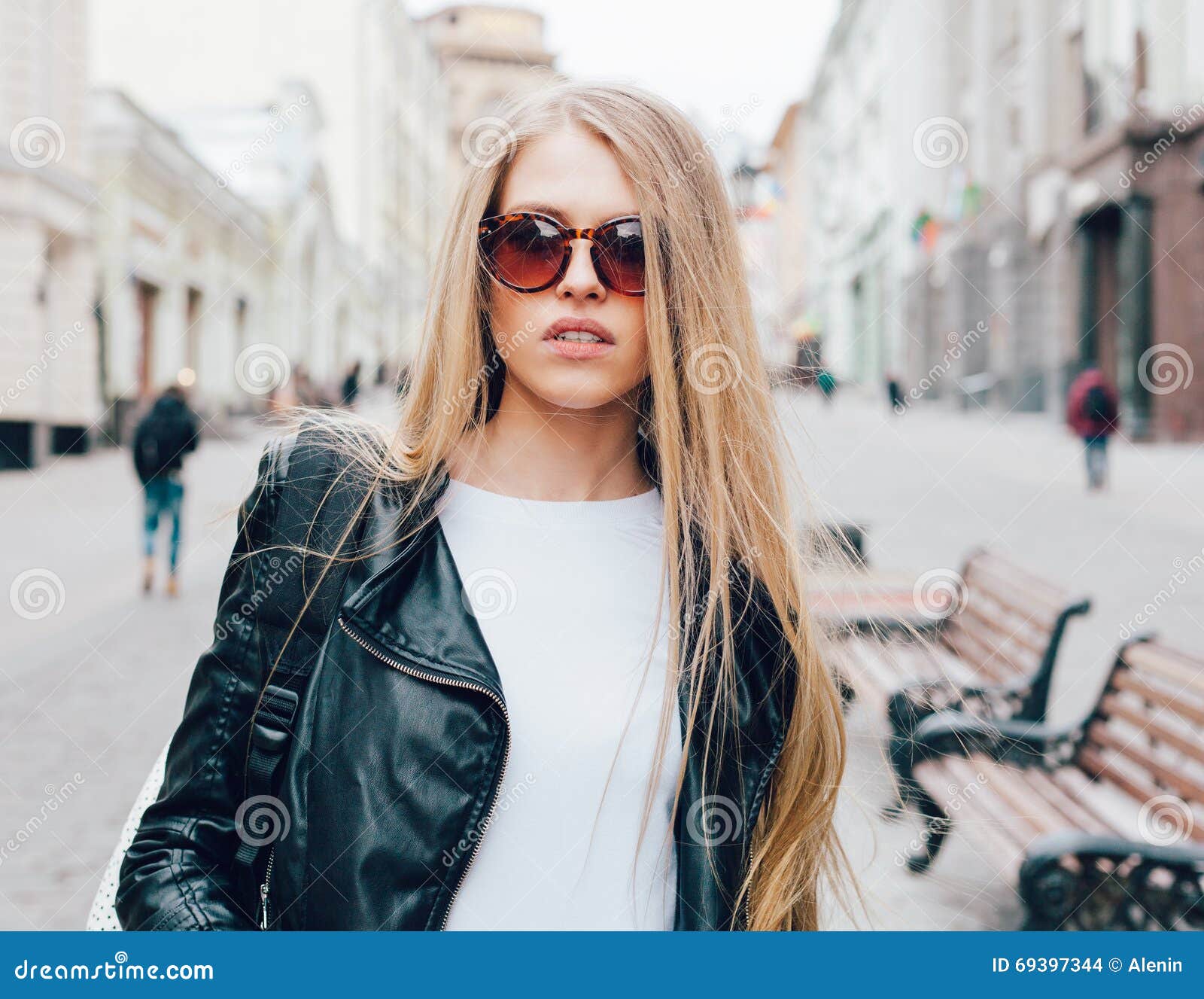 Portrait Of A Young Beautiful Blonde Girl With Sunglasses Walking On 