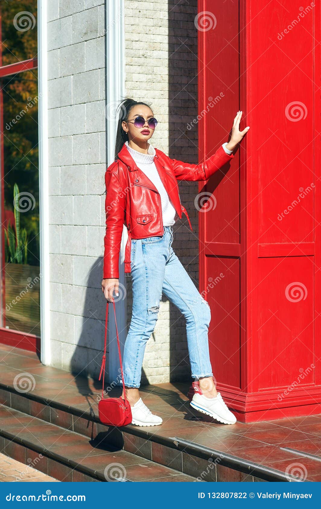 Portrait Of A Young Beautiful Fashion Model In A Leather Biker Jacket Stock  Photo - Image Of Girl, Jeans: 132807822