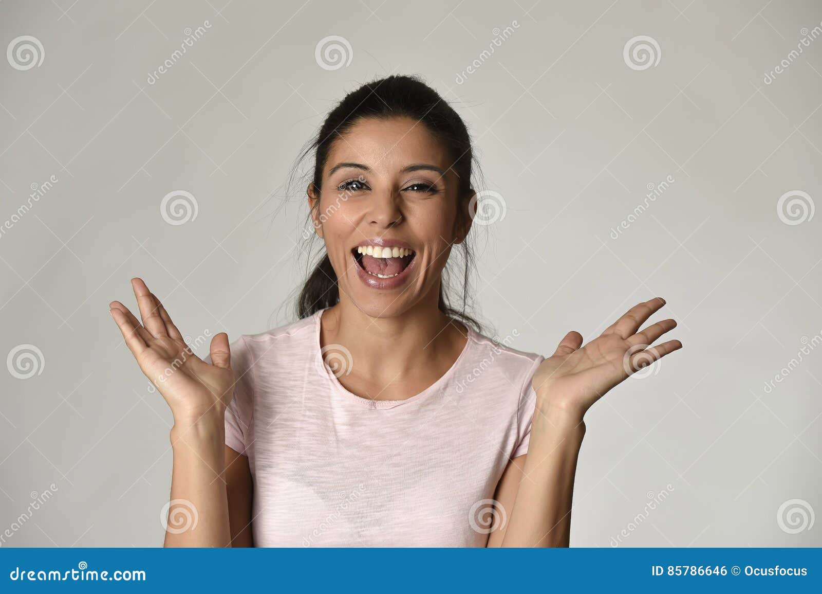 portrait of young beautiful and happy latin woman with big toothy smile excited and cheerful