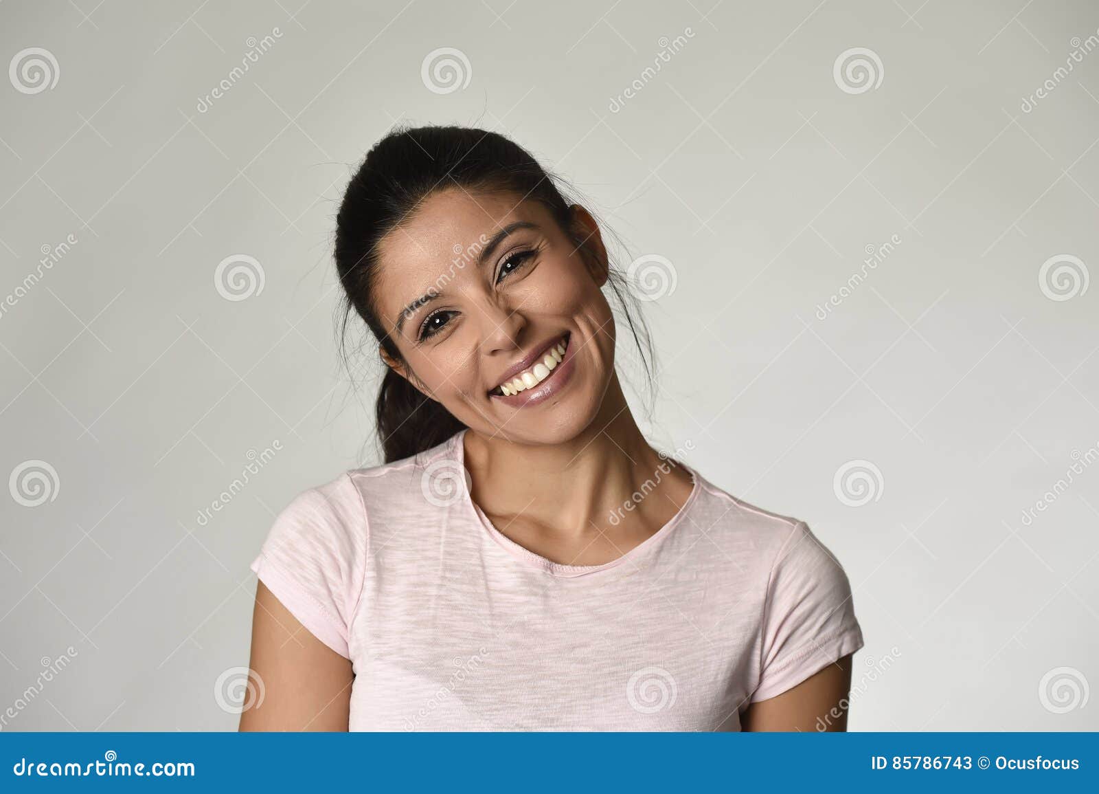 portrait of young beautiful and happy latin woman with big toothy smile excited and cheerful