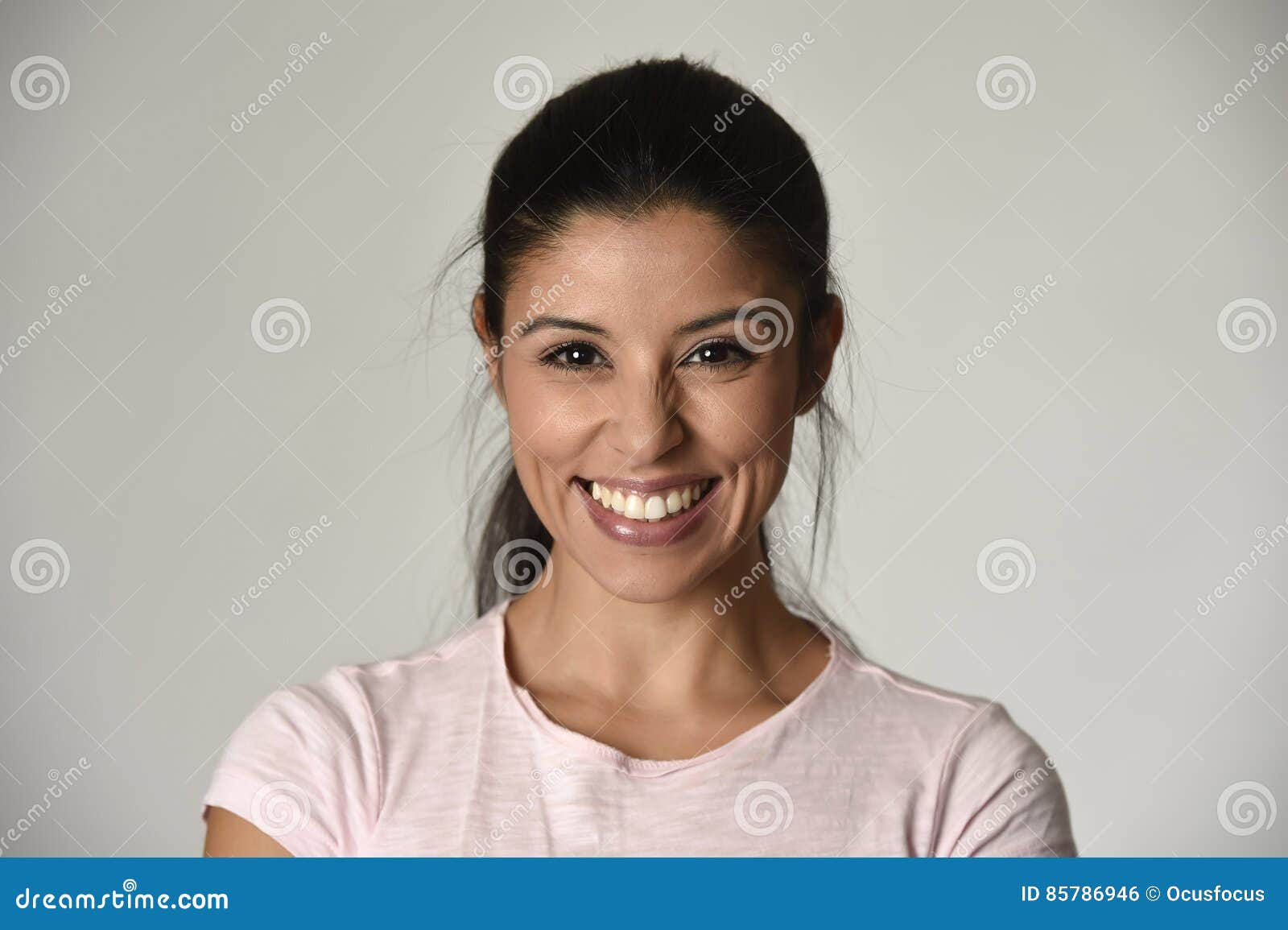 portrait of young beautiful and happy latin woman with big toothy smile excited and cheerful