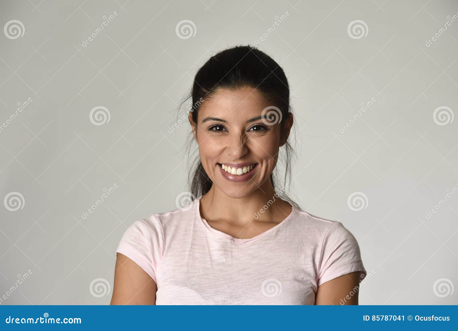 portrait of young beautiful and happy latin woman with big toothy smile excited and cheerful