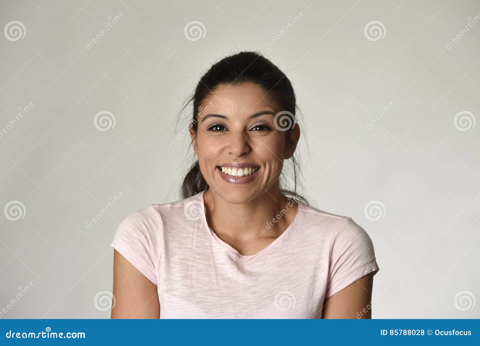 portrait of young beautiful and happy latin woman with big toothy smile excited and cheerful