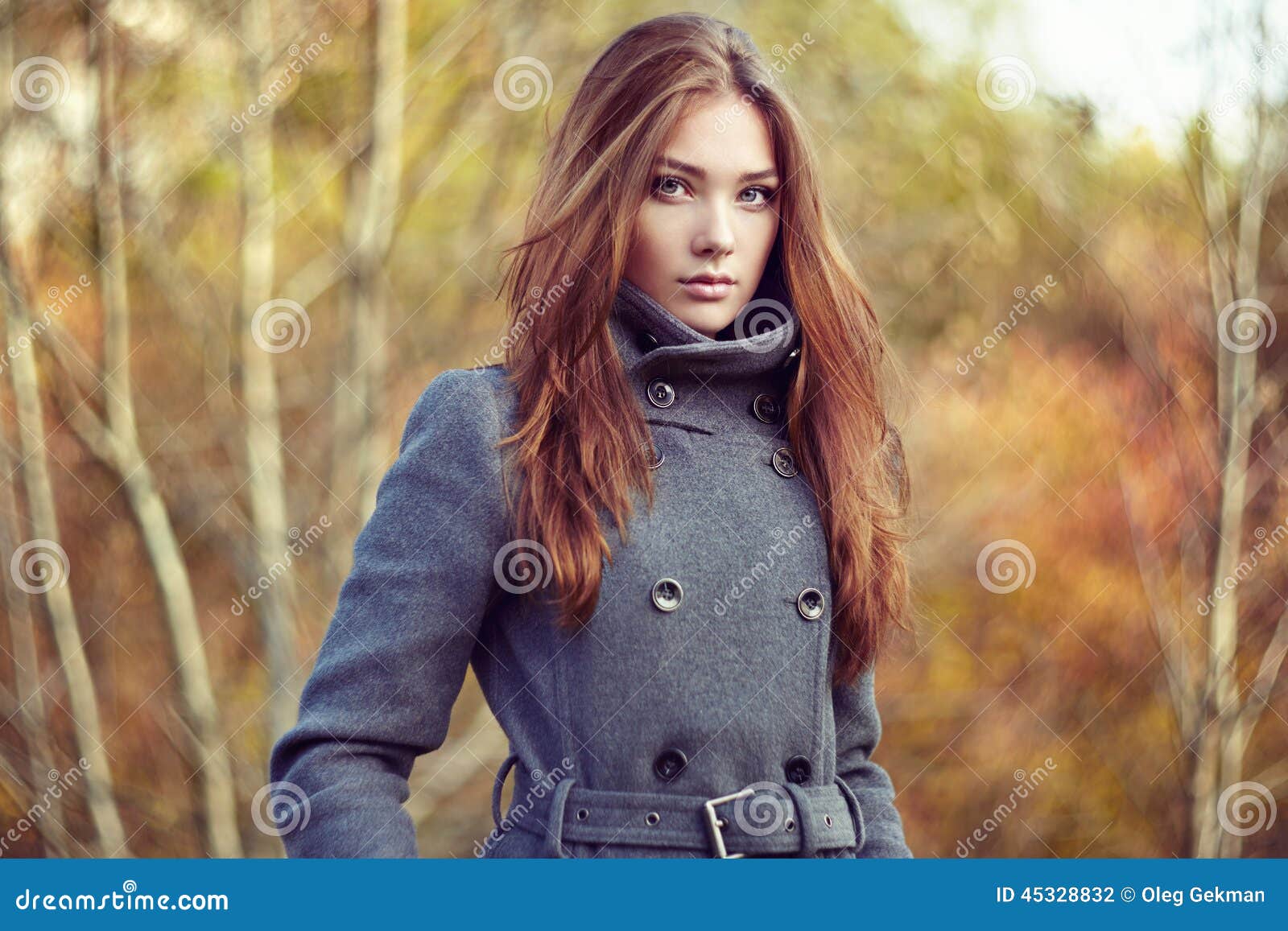 portrait of young beautiful woman in autumn coat