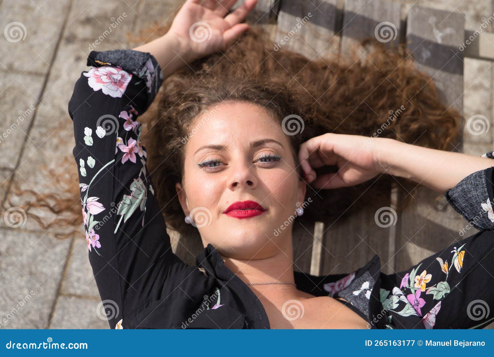 Portrait Of A Young And Beautiful Woman Blonde With Curly Hair And Blue Eyes Floral Dress And 