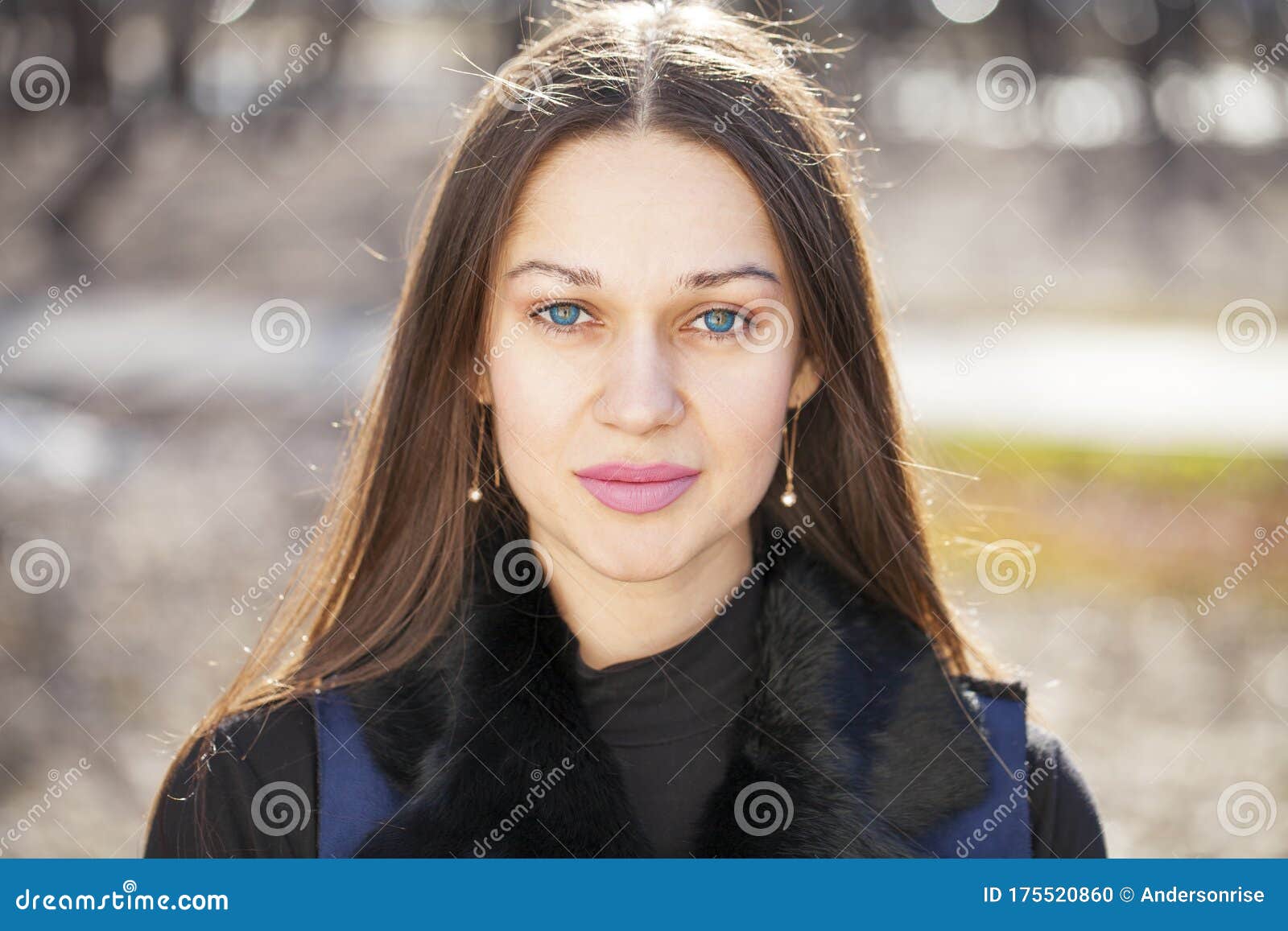 Portrait of a Young Beautiful Woman in Blue Coat in Spring Park Stock ...