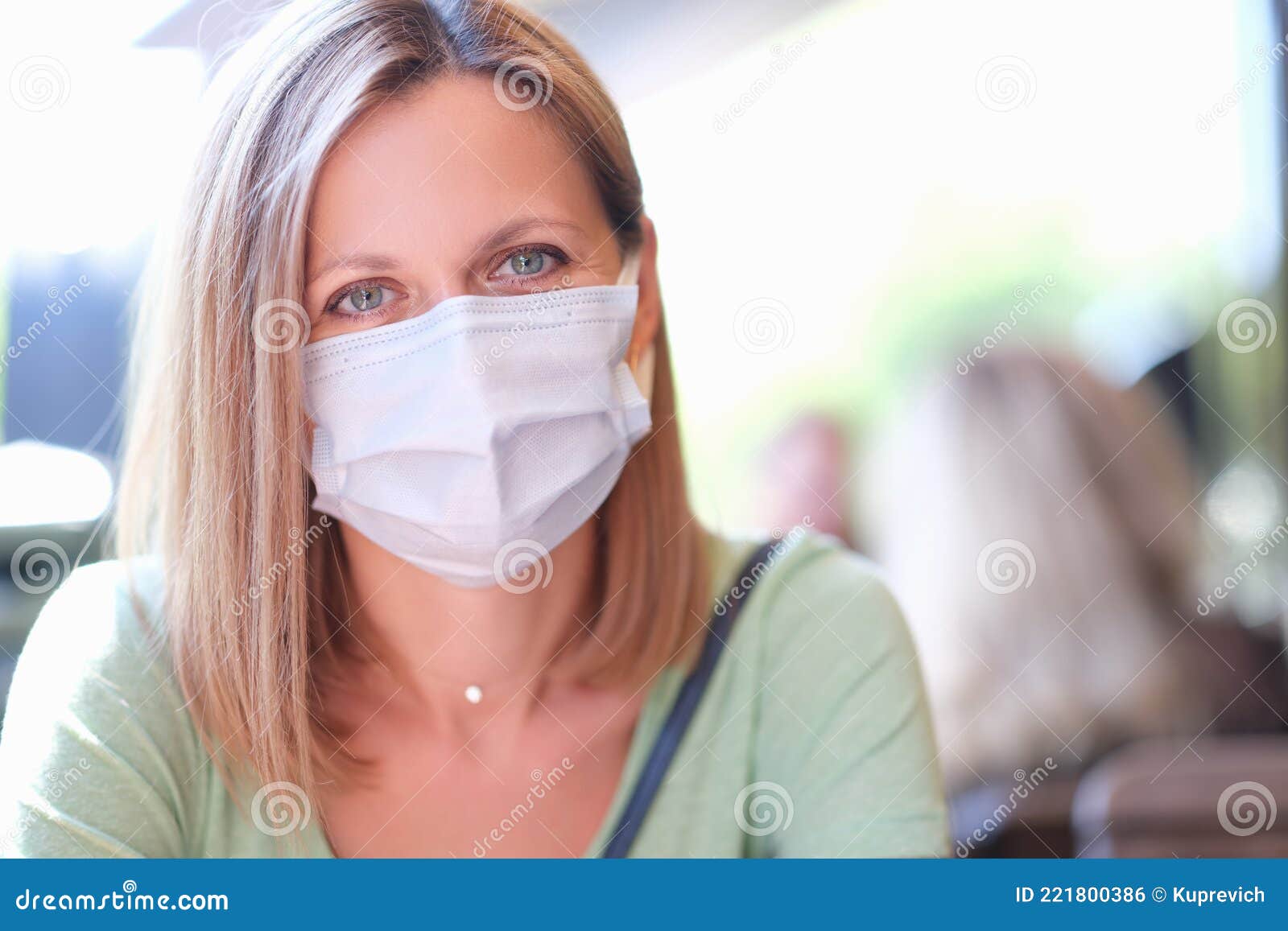 portrait of young beautiful woman in medical protective mask