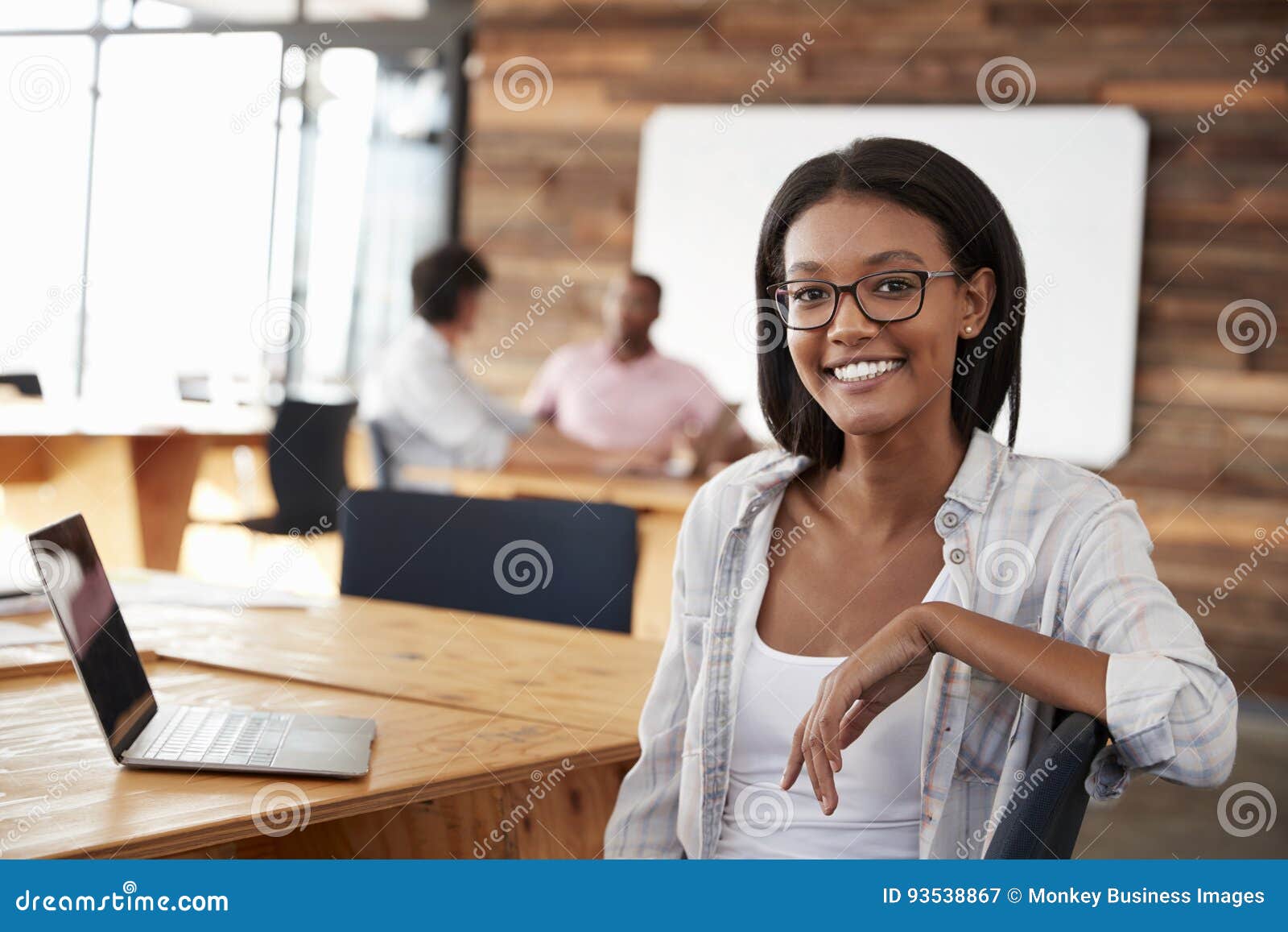 portrait of young black woman in creative office