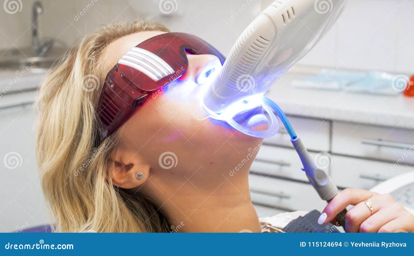 Portrait Of Young Blonde Woman In Dentist Chair During